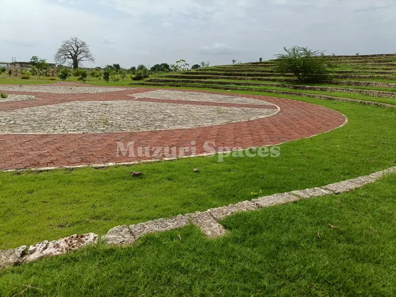 After: Kilifi park amphitheatre complete: grassed terraces around the brick and coral-stone stage